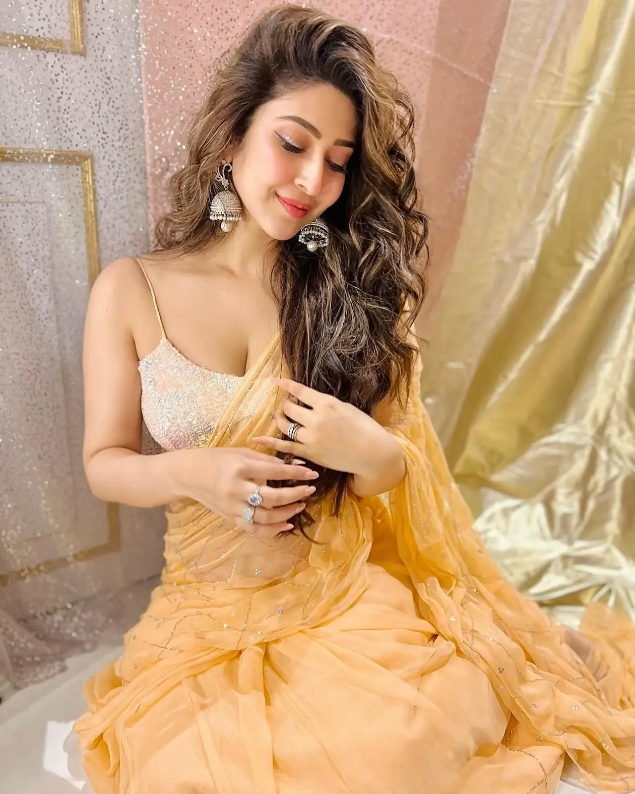 South Indian Girl Sonarika Bhadoria Long Hair Stills in Orange Saree